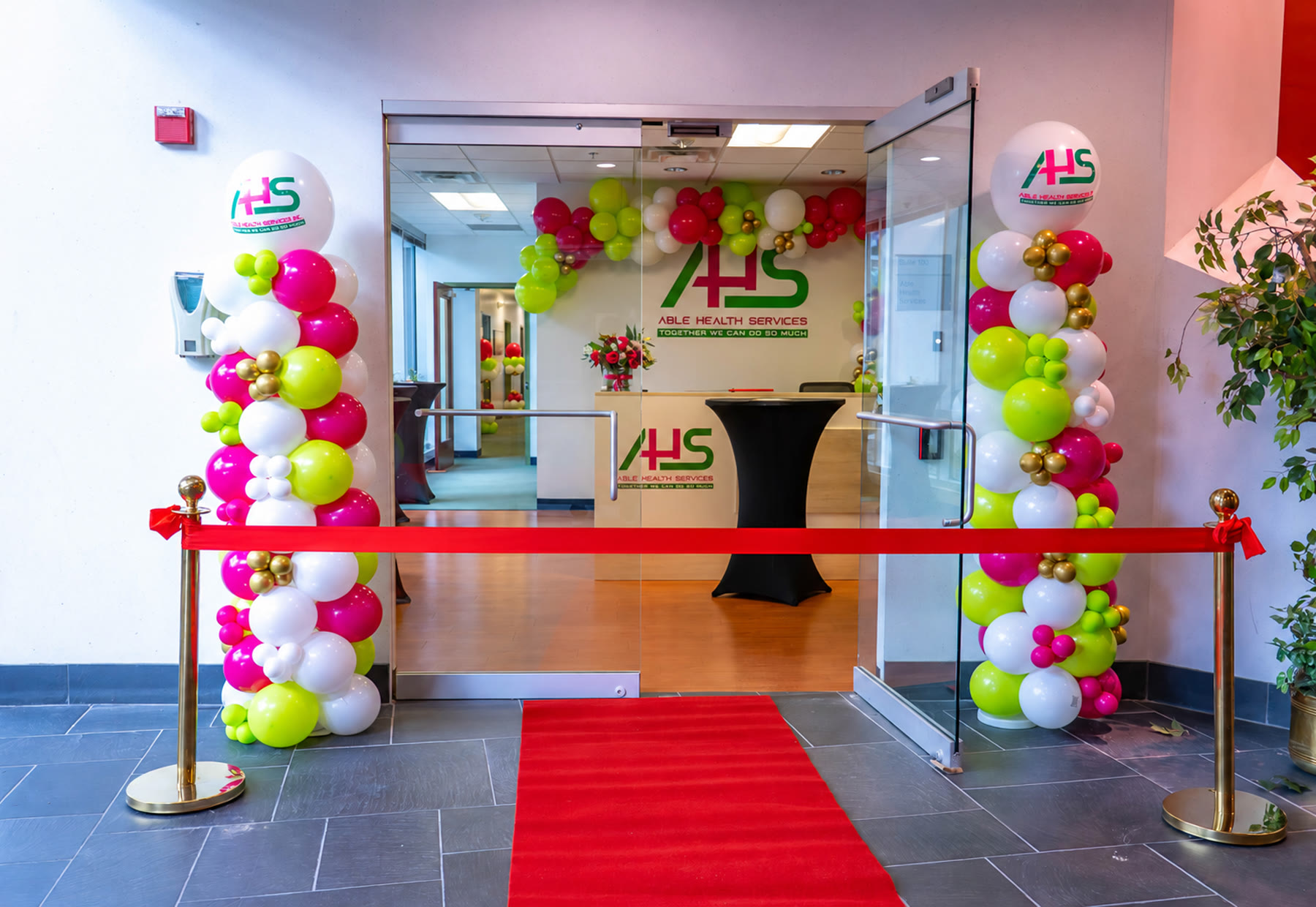 Able Health Services grand opening — red carpet, ribbon cutting, and branded balloon columns in Hanover, Maryland by Creative Motion Events